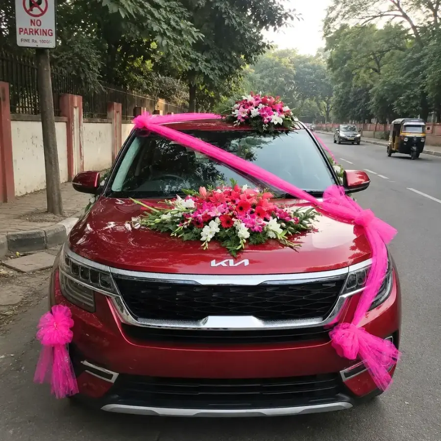 Pink Floral Wedding Car Decoration — decoration setup in Pune
